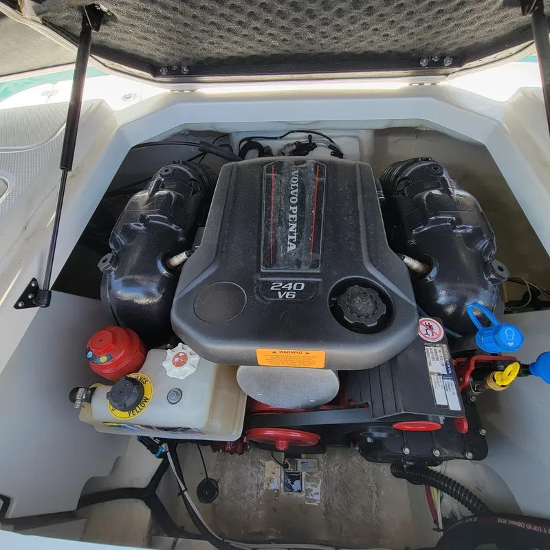 Slide: The Image of 2019 Chaparral 21 H2O Sport engine compartment with Volvo Penta 240 V6 engine. - 6