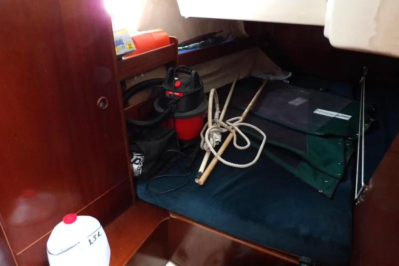 Slide: The Image of Interior cabin of a 1994 Beneteau Oceanis 351 sailboat with storage items. - 36