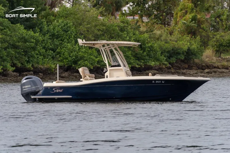 Slide: The Image of 2023 Scout 215 XSF boat on water, featuring sleek design and Yamaha outboard motor. - 3