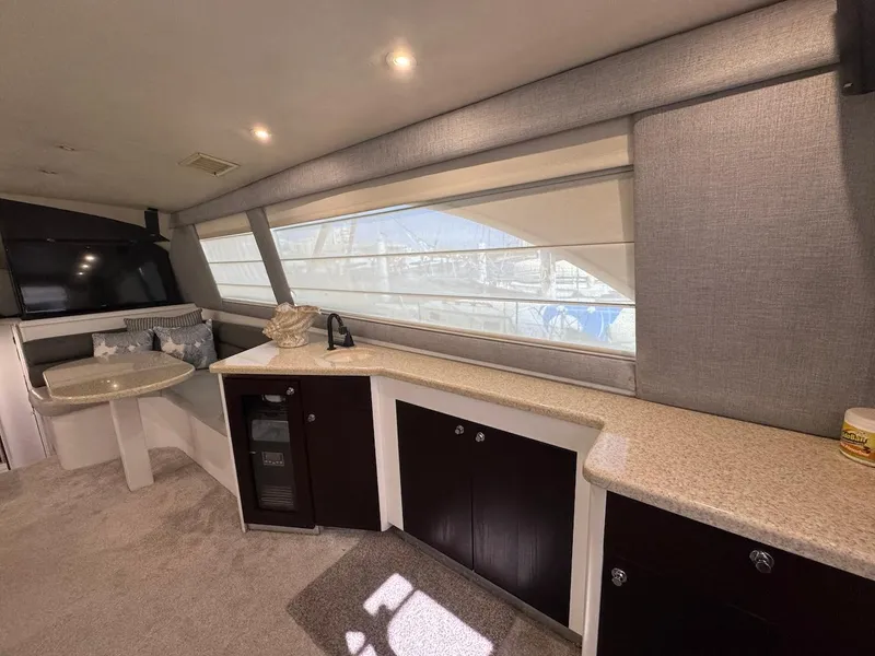 Slide: The Image of Interior of 2000 Ocean Yachts 48 Convertible, featuring modern cabinetry and large windows. - 15