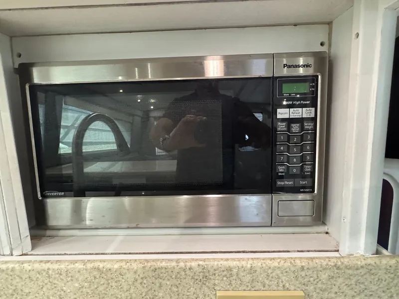 Slide: The Image of Built-in Panasonic microwave in 2000 Ocean Yachts 48 Convertible kitchen. - 22