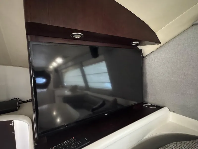 Slide: The Image of Flat-screen TV in Ocean Yachts 48 Convertible, 2000 model, luxurious interior setting. - 23
