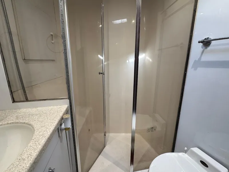 Slide: The Image of Bathroom interior of 2000 Ocean Yachts 48 Convertible, featuring shower and sink. - 29