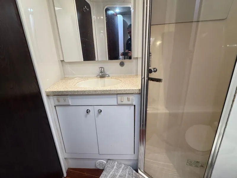 Slide: The Image of Bathroom interior of 2000 Ocean Yachts 48 Convertible, featuring sink and shower. - 33