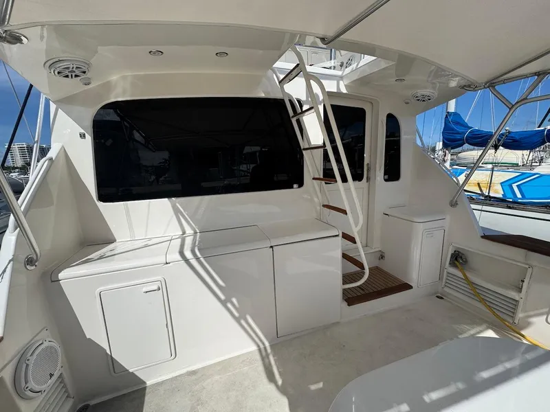 Slide: The Image of 2000 Ocean Yachts 48 Convertible yacht deck with stairs and storage compartments. - 43