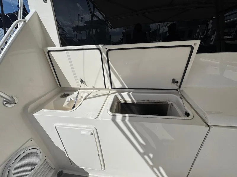 Slide: The Image of Ocean Yachts 48 Convertible 2000 model with open storage compartments on deck. - 44