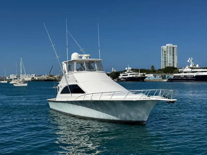 Slide: The Image of Ocean Yachts 48 Convertible 2000 model in a marina, clear blue sky background. - 9