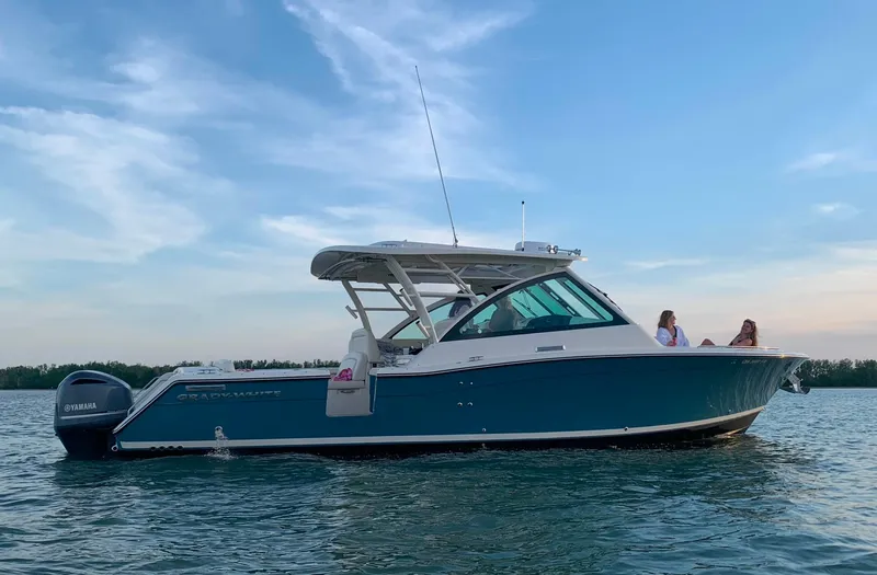 Slide: The Image of 2019 Grady-White Freedom 375 boat on calm water, side view. - 13