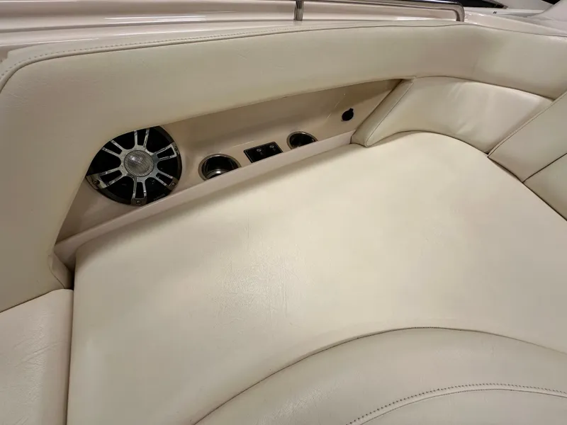 Slide: The Image of 2019 Grady-White Freedom 375 boat interior with beige leather seating and built-in speaker system. - 35