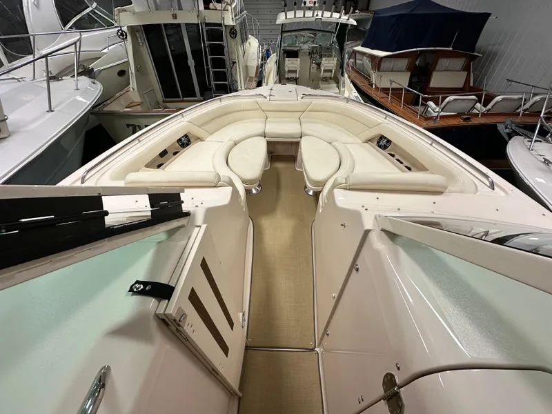 Slide: The Image of 2019 Grady-White Freedom 375 boat interior with spacious seating in a marina. - 37
