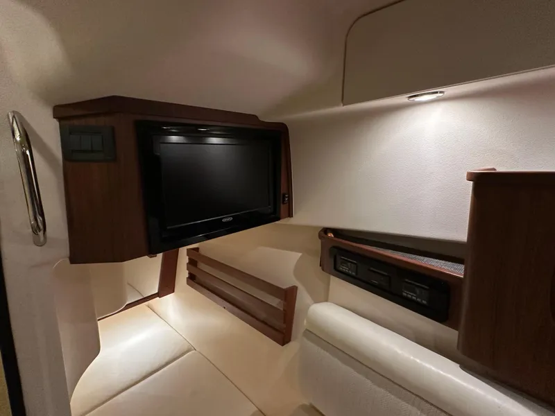 Slide: The Image of 2019 Grady-White Freedom 375 cabin interior with TV and seating area. - 39