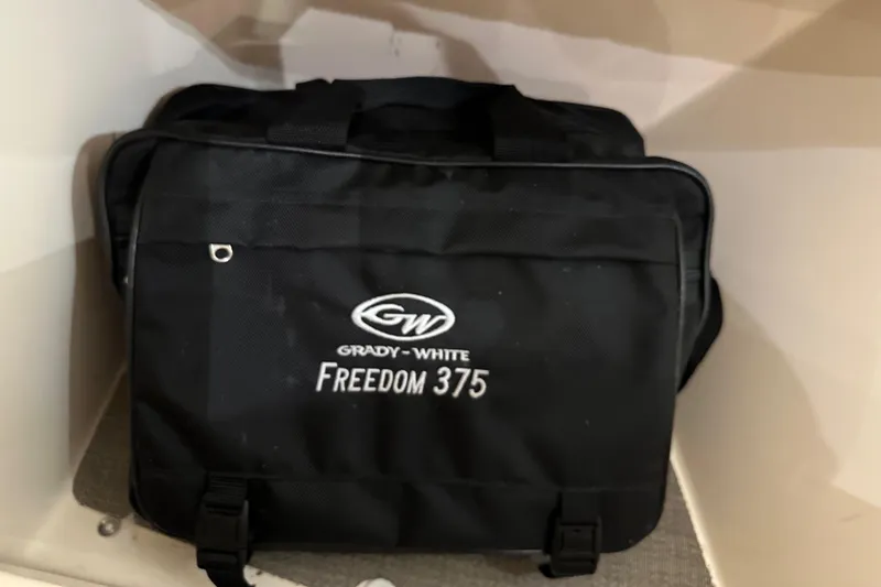 Slide: The Image of Black Grady-White Freedom 375 bag, 2019 model, inside a storage compartment. - 43