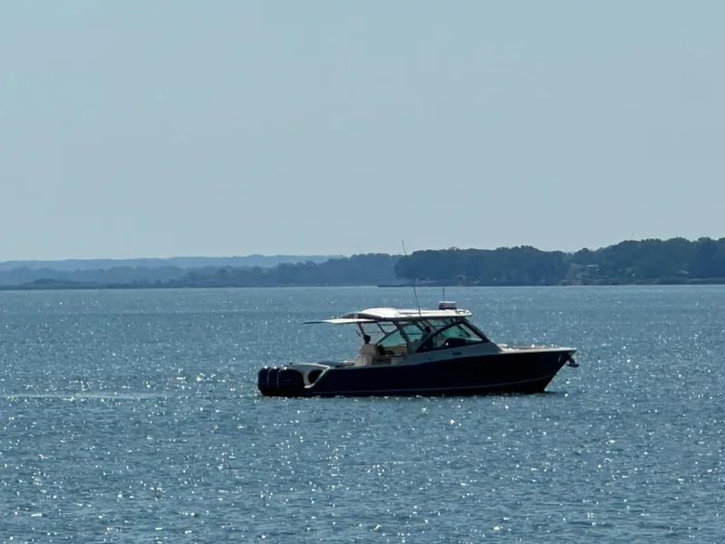 Slide: The Image of 2019 Grady-White Freedom 375 boat cruising on a sunny, sparkling sea. - 46