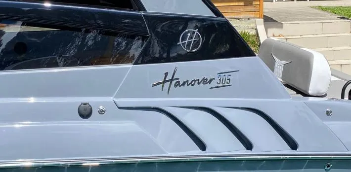 Slide: The Image of 2025 Hanover 305 Outboard Alpine Gray Ultimate Sport Edition boat, sleek design detail. - 3