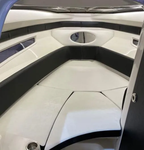 Slide: The Image of 2025 Hanover 305 Outboard T-Top Edition interior, featuring sleek black and white seating. - 11