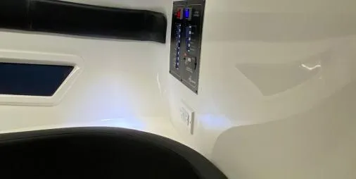 Slide: The Image of Interior view of 2025 Hanover 305 Outboard Black & White T-Top Edition boat. - 9