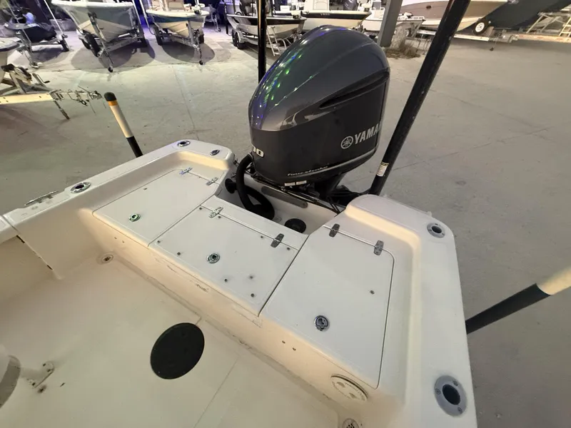 Slide: The Image of 2013 BlackJack 224 boat with Yamaha outboard motor in a showroom. - 5