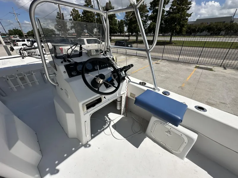 Slide: The Image of 2005 Twin Vee 22 boat cockpit with steering wheel and control panel. - 7