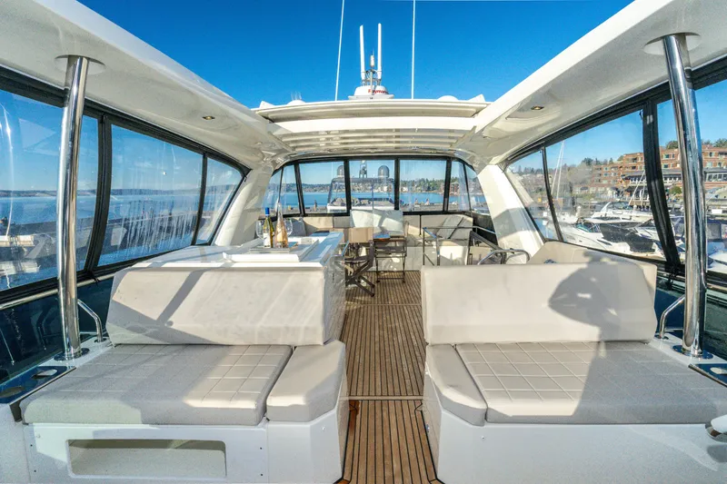 Slide: The Image of Luxurious interior of 2018 Prestige 630 yacht with spacious seating and panoramic windows. - 13