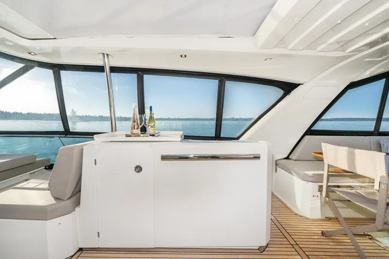Slide: The Image of Luxurious interior of 2018 Prestige 630 yacht with panoramic windows and elegant seating. - 21