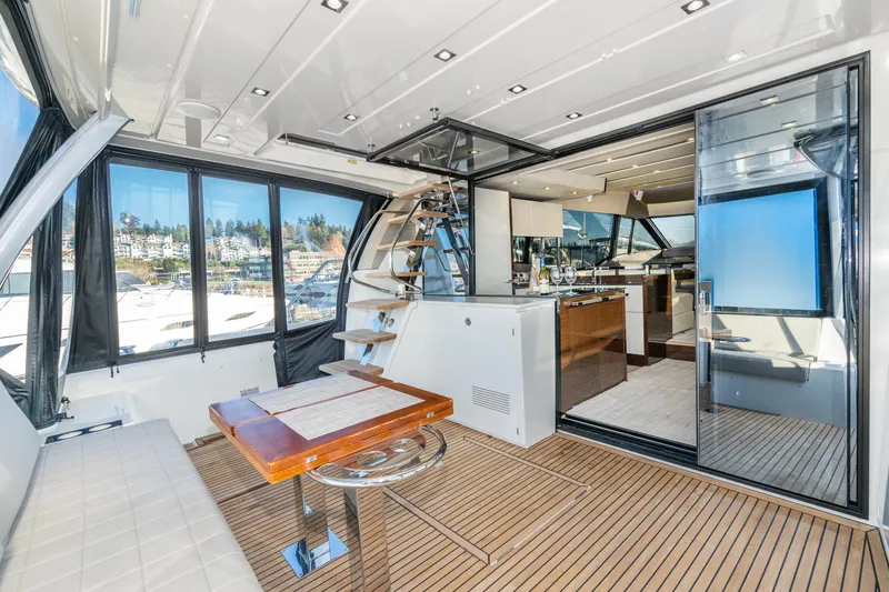 Slide: The Image of Luxurious 2018 Prestige 630 yacht interior with modern design and spacious seating area. - 25