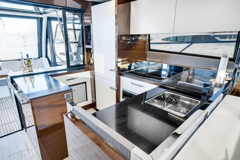 Slide: The Image of Luxurious kitchen interior of 2018 Prestige 630 yacht with modern appliances and sleek design. - 40