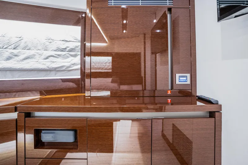 Slide: The Image of Luxurious interior of 2018 Prestige 630 yacht with sleek wooden cabinetry. - 47