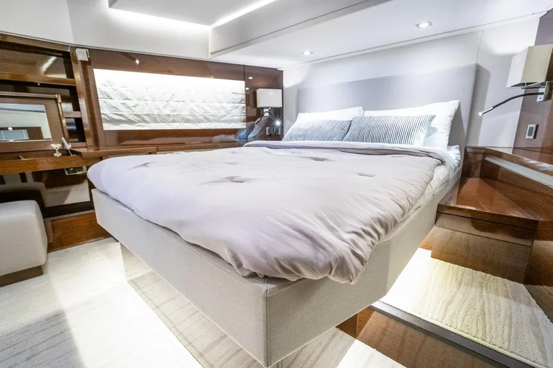 Slide: The Image of Luxurious bedroom interior of 2018 Prestige 630 yacht with modern design and elegant furnishings. - 48