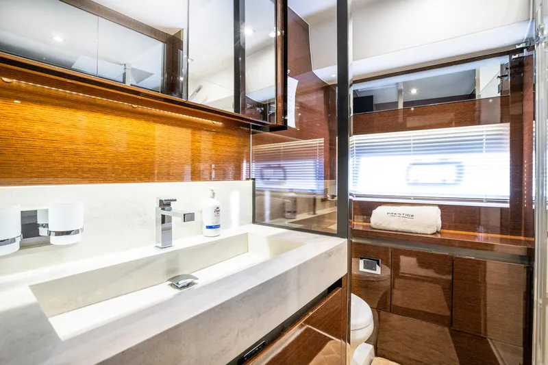 Slide: The Image of Luxurious bathroom interior of 2018 Prestige 630 yacht with modern fixtures and elegant design. - 49
