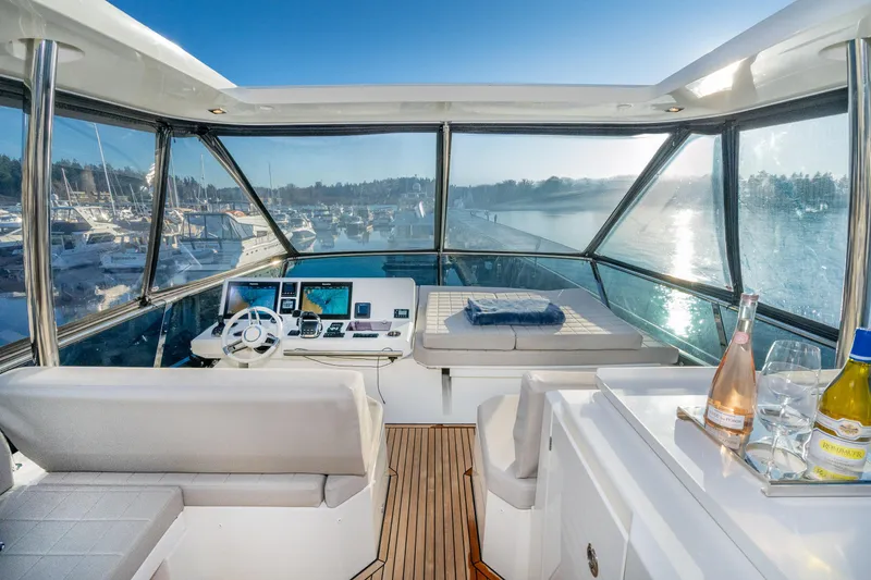 Slide: The Image of Luxurious 2018 Prestige 630 yacht interior with scenic marina view. - 8