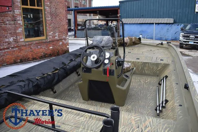 Slide: The Image of 2023 Tracker GRIZZLY® 2072 CC boat, olive green interior, docked at Thayer's Marine. - 10