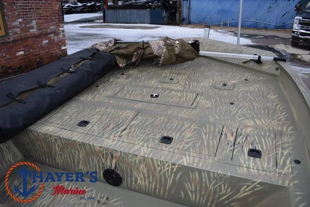 Slide: The Image of 2023 Tracker GRIZZLY® 2072 CC boat with camouflage pattern, displayed at Thayer's Marine. - 12