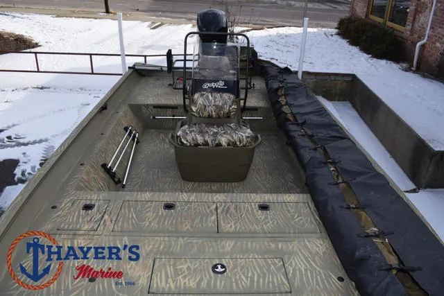 Slide: The Image of 2023 Tracker GRIZZLY® 2072 CC boat with camouflage seating, displayed at Thayer's Marine. - 18