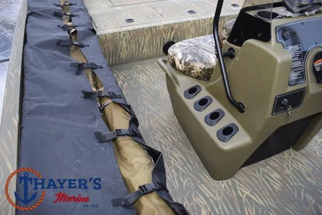 Slide: The Image of 2023 Tracker GRIZZLY® 2072 CC boat interior with camo seating and Thayer's Marine logo. - 23