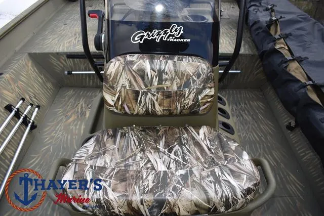 Slide: The Image of 2023 Tracker GRIZZLY® 2072 CC boat interior with camo seats and steering console. - 24