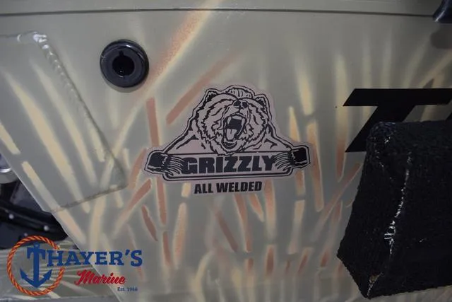 Slide: The Image of 2023 Tracker GRIZZLY® 2072 CC boat with "All Welded" logo and Thayer's Marine branding. - 4