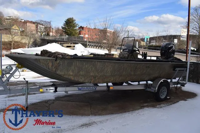 Slide: The Image of 2023 Tracker GRIZZLY® 2072 CC boat on trailer at Thayer's Marine in snowy setting. - 7