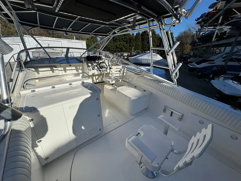 Slide: The Image of 2008 Fountain 38 Sportfish Express Cruiser interior with helm and seating area. - 19
