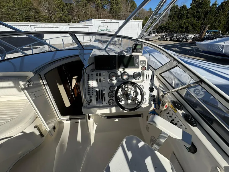 Slide: The Image of 2008 Fountain 38 Sportfish Express Cruiser helm with modern controls and navigation equipment. - 21