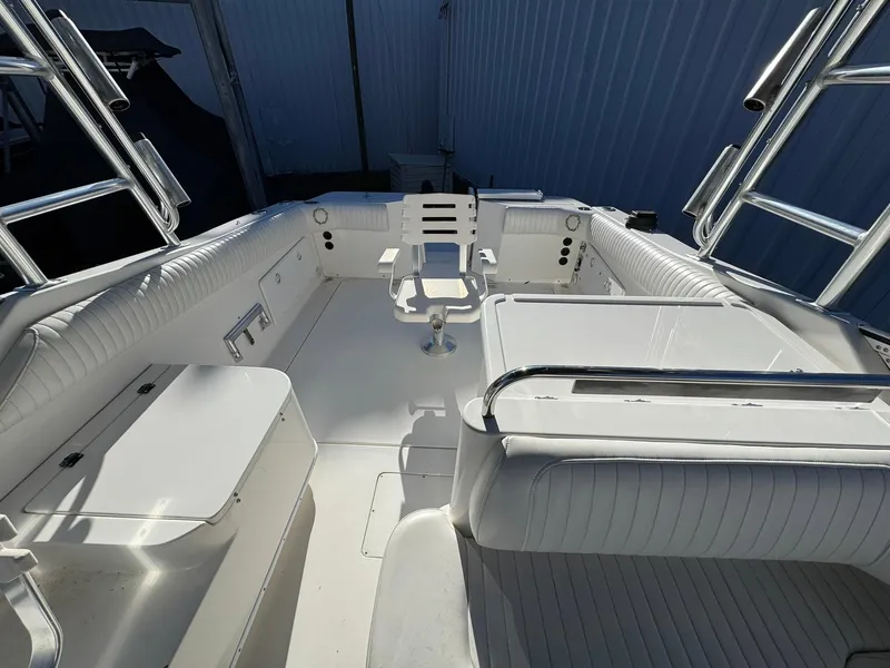 Slide: The Image of 2008 Fountain 38 Sportfish Express Cruiser, spacious white deck with seating and fishing chair. - 23