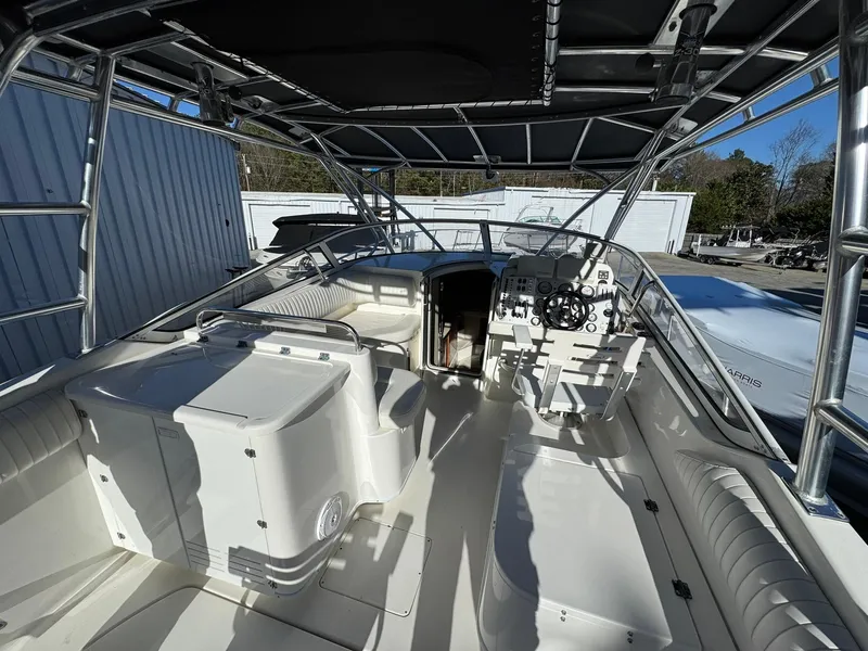 Slide: The Image of 2008 Fountain 38 Sportfish Express Cruiser interior with helm and seating area. - 24
