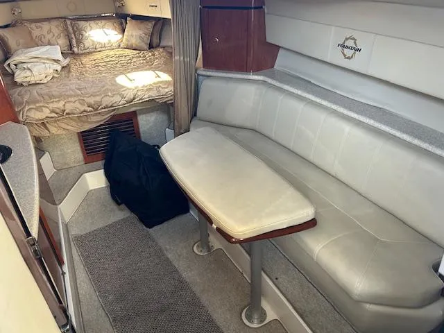 Slide: The Image of 2008 Fountain 38 Sportfish Express Cruiser interior with seating and bed area. - 28