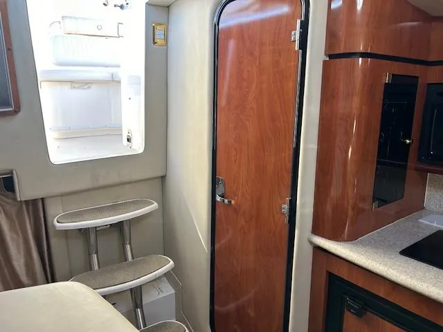 Slide: The Image of Interior of 2008 Fountain 38 Sportfish Express Cruiser with wooden door and steps. - 30