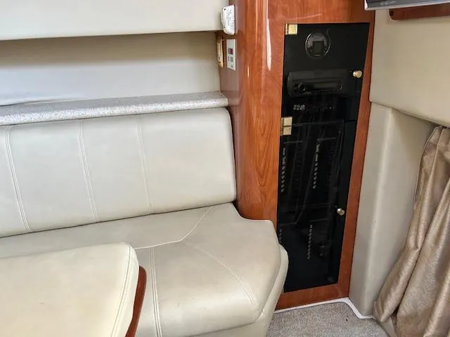 Slide: The Image of 2008 Fountain 38 Sportfish Express Cruiser interior with seating and wooden cabinetry. - 36