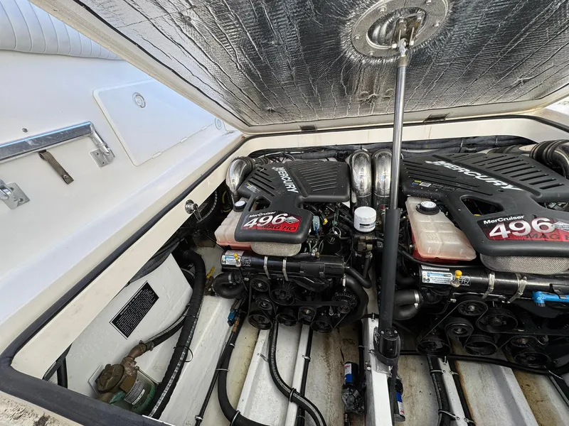 Slide: The Image of Engine compartment of a 2008 Fountain 38 Sportfish Express Cruiser with twin MerCruiser 496 engines. - 43