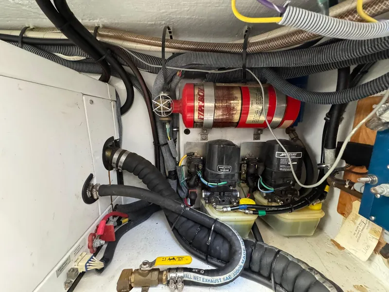 Slide: The Image of Engine compartment of 2008 Fountain 38 Sportfish Express Cruiser with wiring and fire extinguisher system. - 45