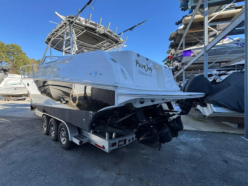 Slide: The Image of 2008 Fountain 38 Sportfish Express Cruiser on trailer, parked in a marina storage area. - 6