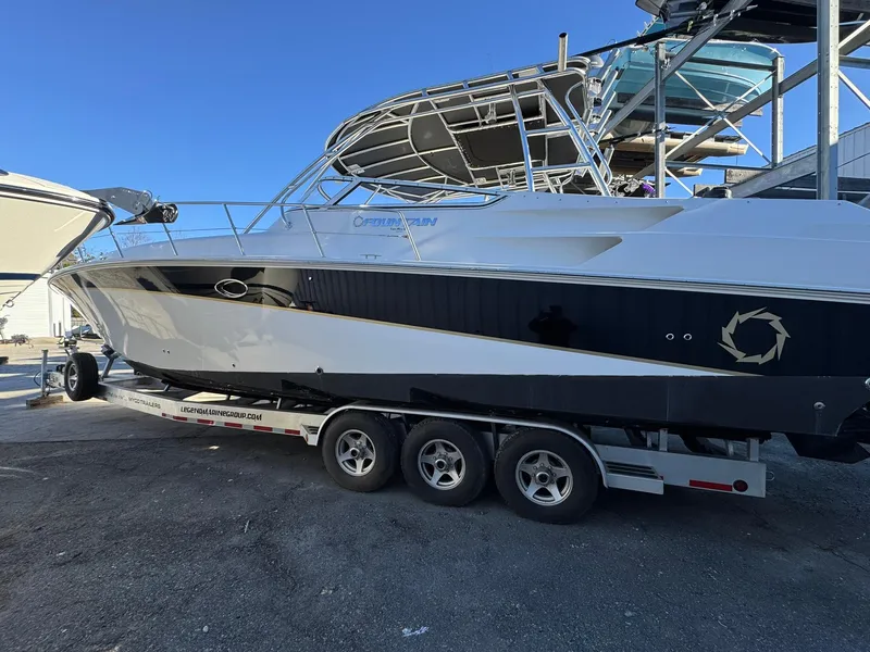 Slide: The Image of 2008 Fountain 38 Sportfish Express Cruiser on trailer, parked outdoors. - 8