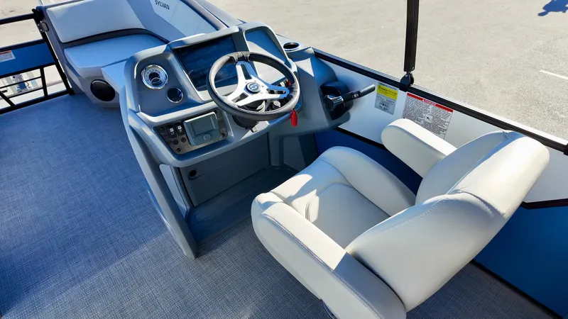 Slide: The Image of 2025 Sylvan A-Series A20 LZ DH boat interior with steering console and seating. - 12