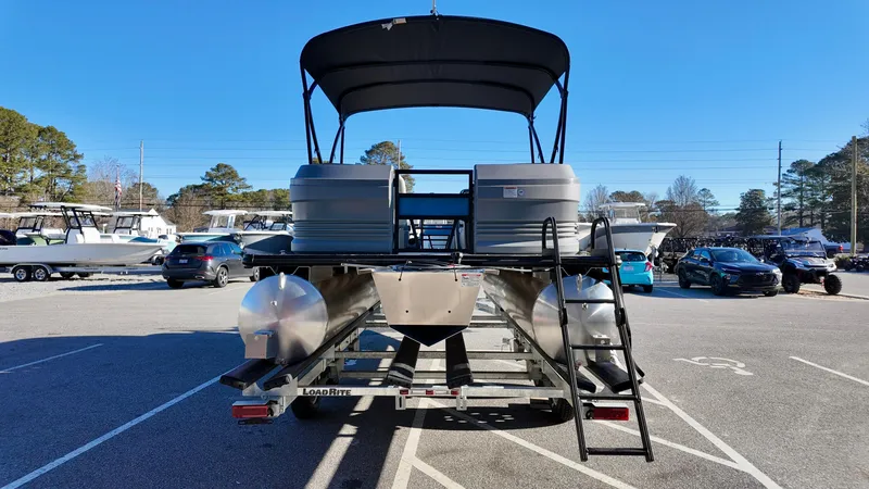 Slide: The Image of 2025 Sylvan A-Series A20 LZ DH pontoon boat in parking lot, rear view. - 3